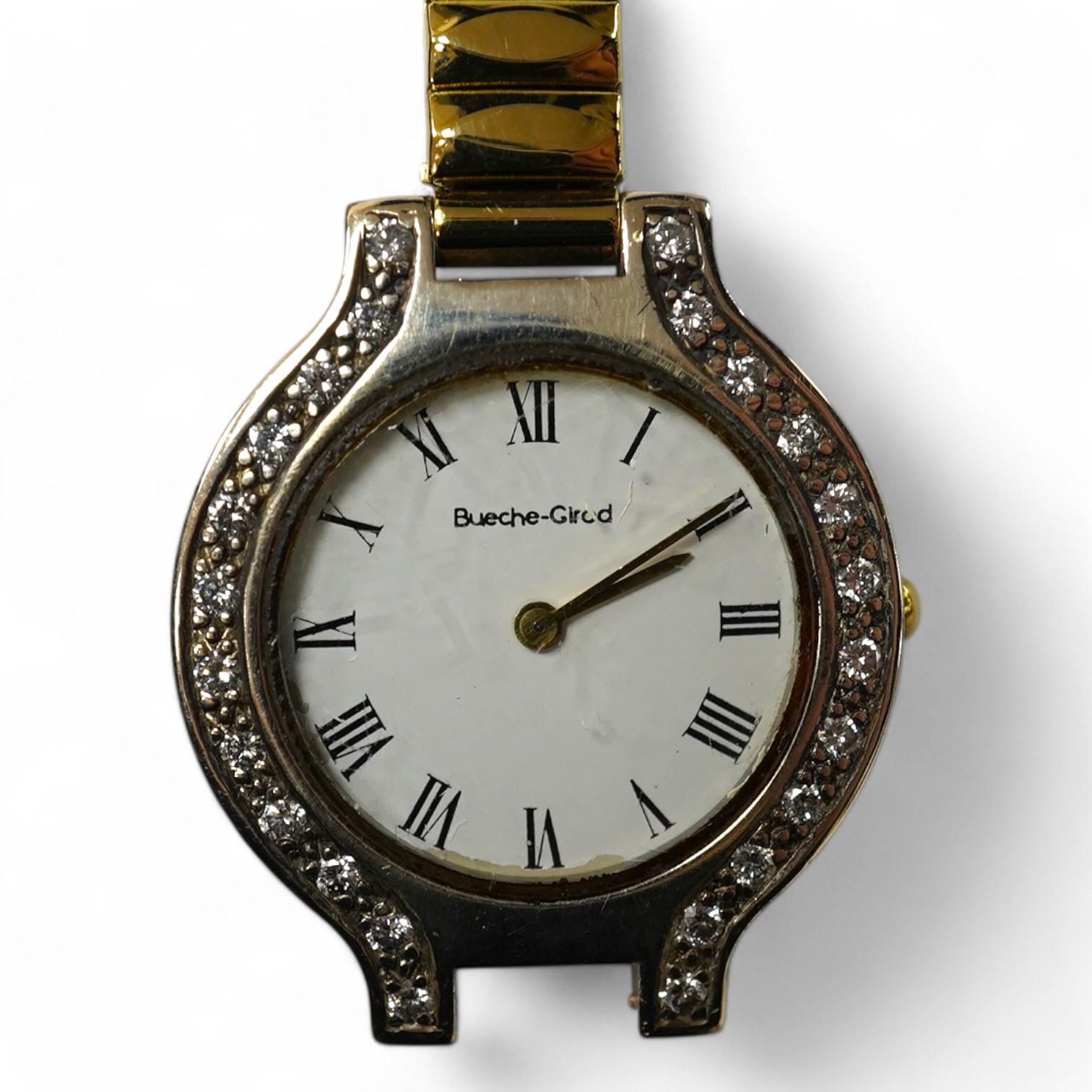 A lady's modern 9kt Bueche Girod quartz wrist watch, with diamond set bezel, case diameter 25mm, on a steel and gold plated flexible bracelet (detached), with Bueche Girod box. Condition - poor to fair